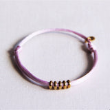 Satijnen armband met ringen – lila/goud - Selva & Co