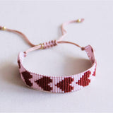 Armband met verweven hart - lila/bordeaux - Selva & Co