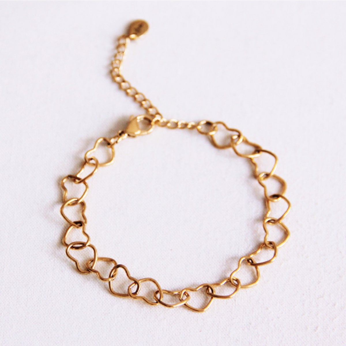 Armband met verbonden harten - goud - Selva & Co