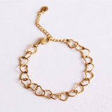 Armband met verbonden harten - goud - Selva & Co