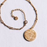 RVS fijne ketting met bolletjes en maan/zon bedel – goud - Selva & Co