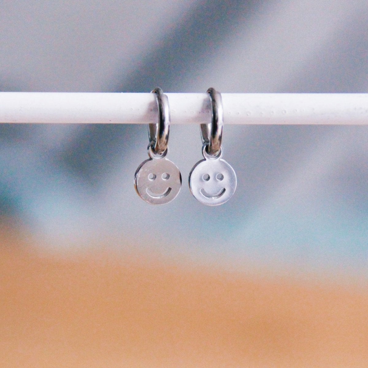 Stainless steel hoop earrings with smiley – silver - Selva & Co