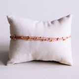 Vierzijdig satijnen armband met kraaltjes - oudroze - Selva & Co