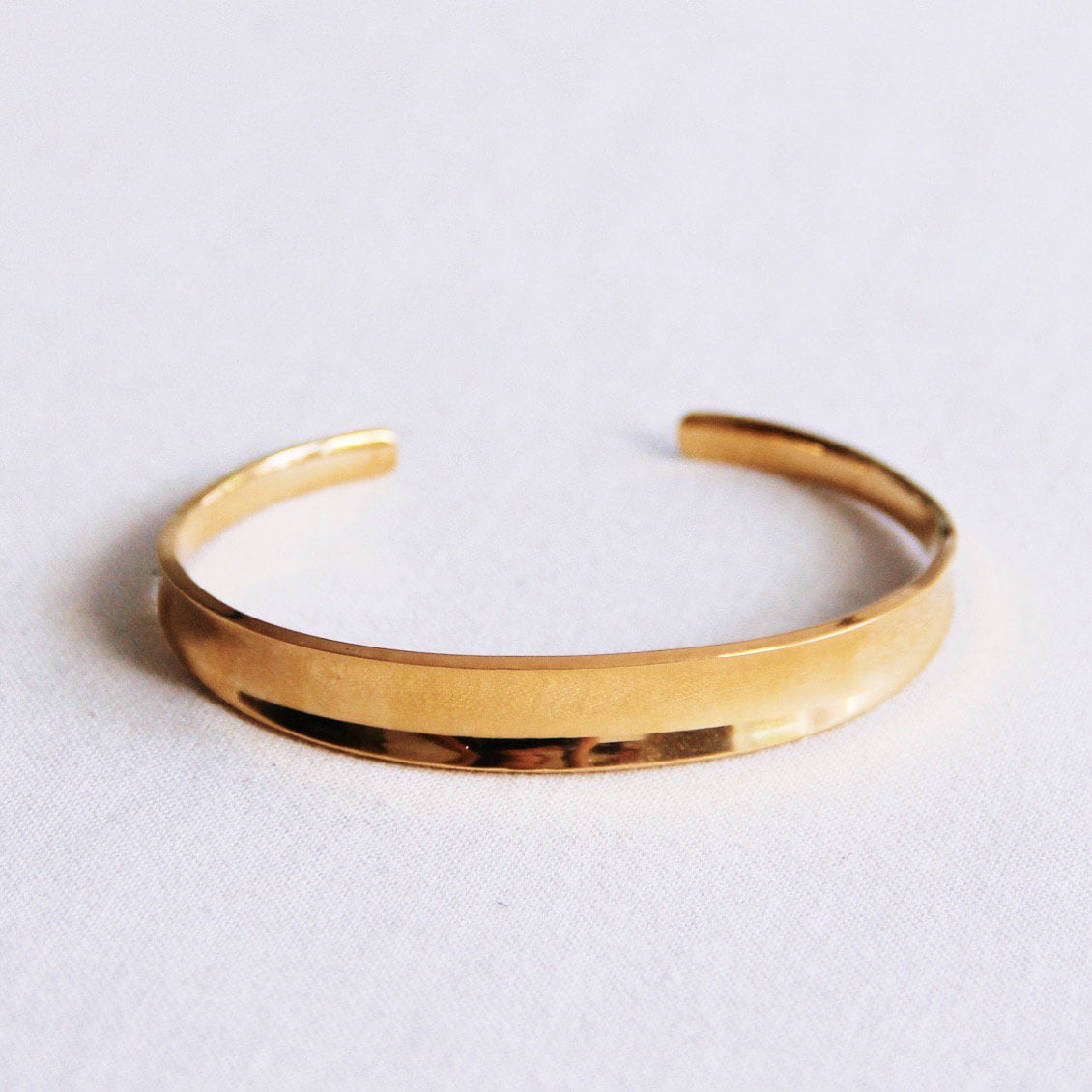 Glanzende open bangle - goud - Selva & Co
