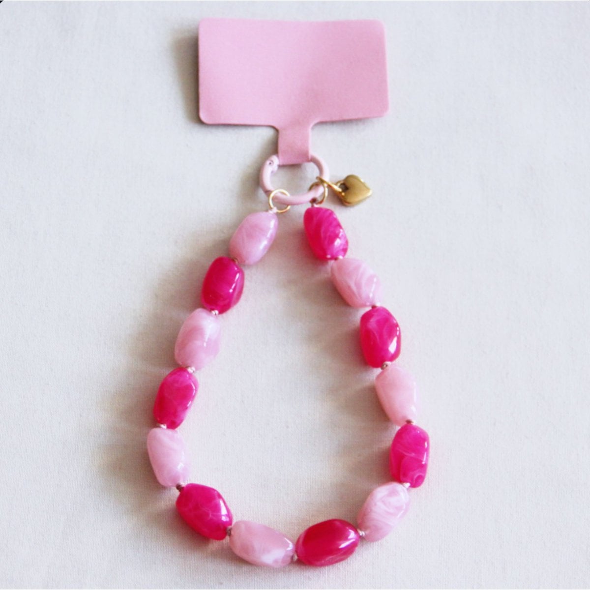 Telefoonsnoer kralen - lichtroze/fuchsia - Selva & Co