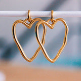 RVS-oorbel met XL open hart – goud - Selva & Co