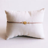 Elastic bracelet with mini flower - taupe - Selva & Co
