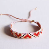 Miyuki armband with red and brown heart pattern, featuring intricate beadwork, by Bazou.