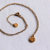 Stainless steel fine chain with smiley - gold - Selva & Co
