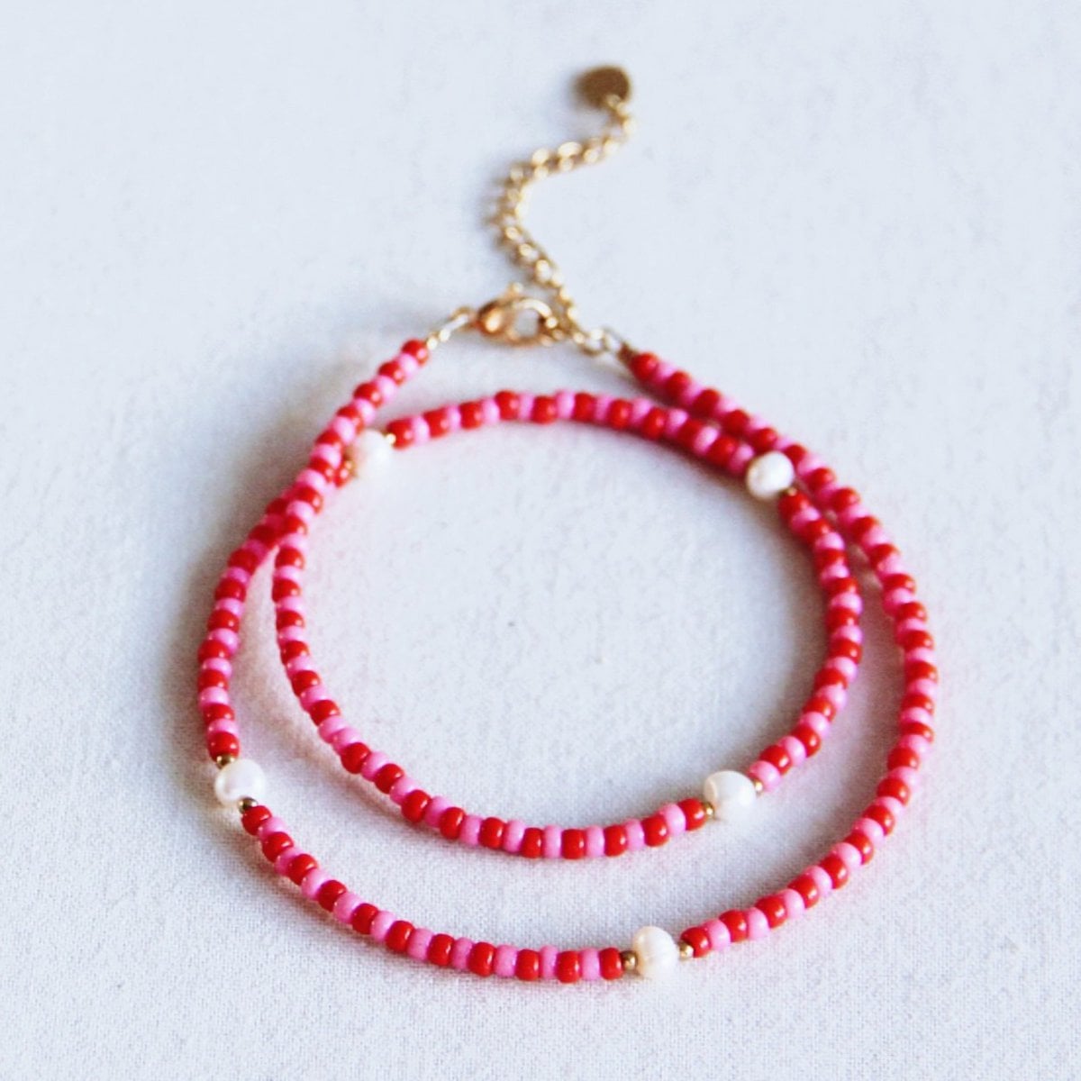 Kralenketting met parels - rood/roze - Selva & Co