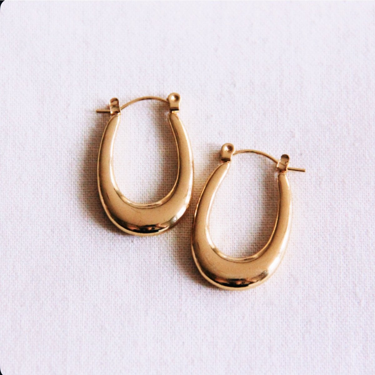 Stainless steel oval earring flared - Selva & Co