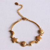 Schakelarmband met zon, maan en ster - goud - Selva & Co