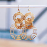 Stainless steel statement earring twisted rings - gold - Selva & Co