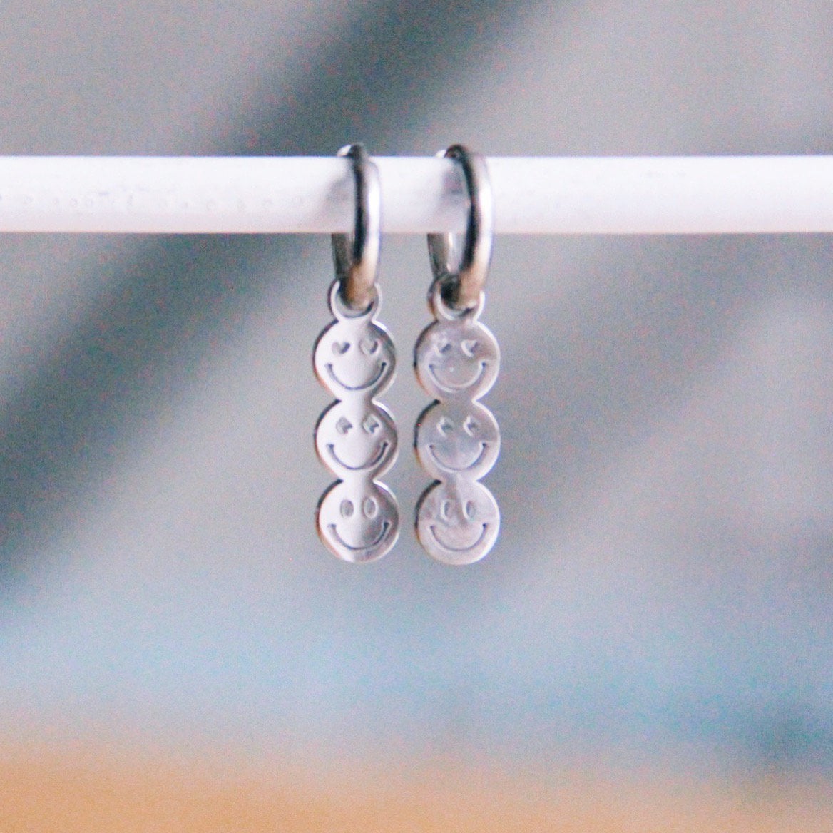 Stainless steel hoop earrings with 3 smileys – silver - Selva & Co