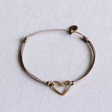 FW134: Elastic bracelet with open heart - taupe/gold - Selva & Co
