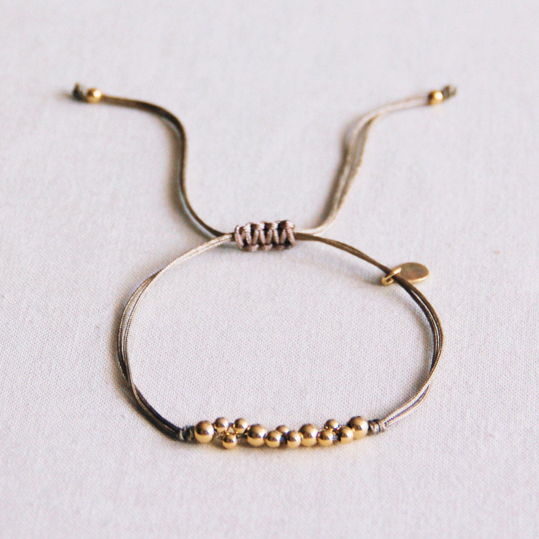 Satin bracelet with gold colored beads - taupe / gold - Selva & Co