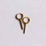 Gold stainless steel hoop earrings with bar detail, stylish and modern jewelry by Bazou.