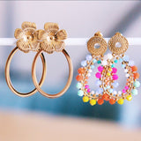 Ovale statement oorringen met bloem - goud - Selva & Co