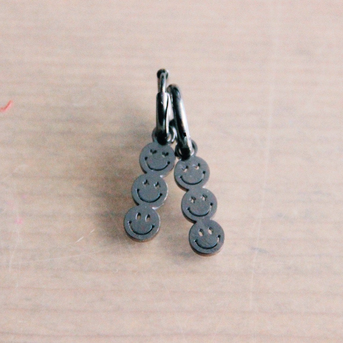 Stainless steel hoop earrings with 3 smileys – silver - Selva & Co