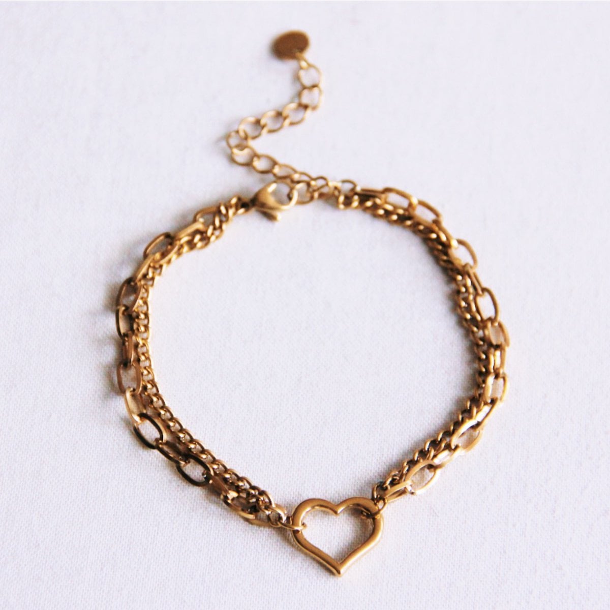 Dubbele schakelarmband met open hart - goud - Selva & Co
