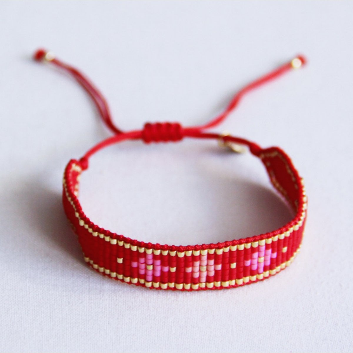 Geweven miyuki- armband met bloemenpatroon - rood/roze - Selva & Co