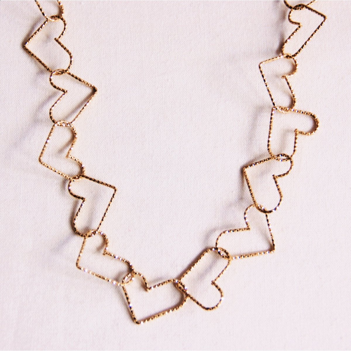 Ketting met verbonden harten 'groot' - goud - Selva & Co