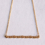 Fine necklace with a row of mini hearts - Selva & Co