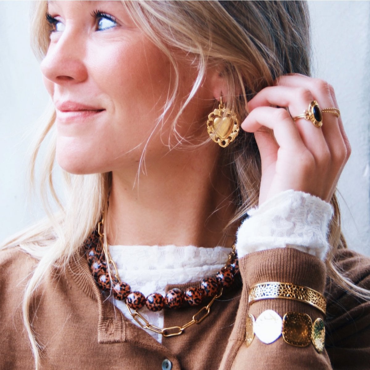 Bazou statement ring featuring an oval brown stone, showcasing a bold and elegant jewelry design.