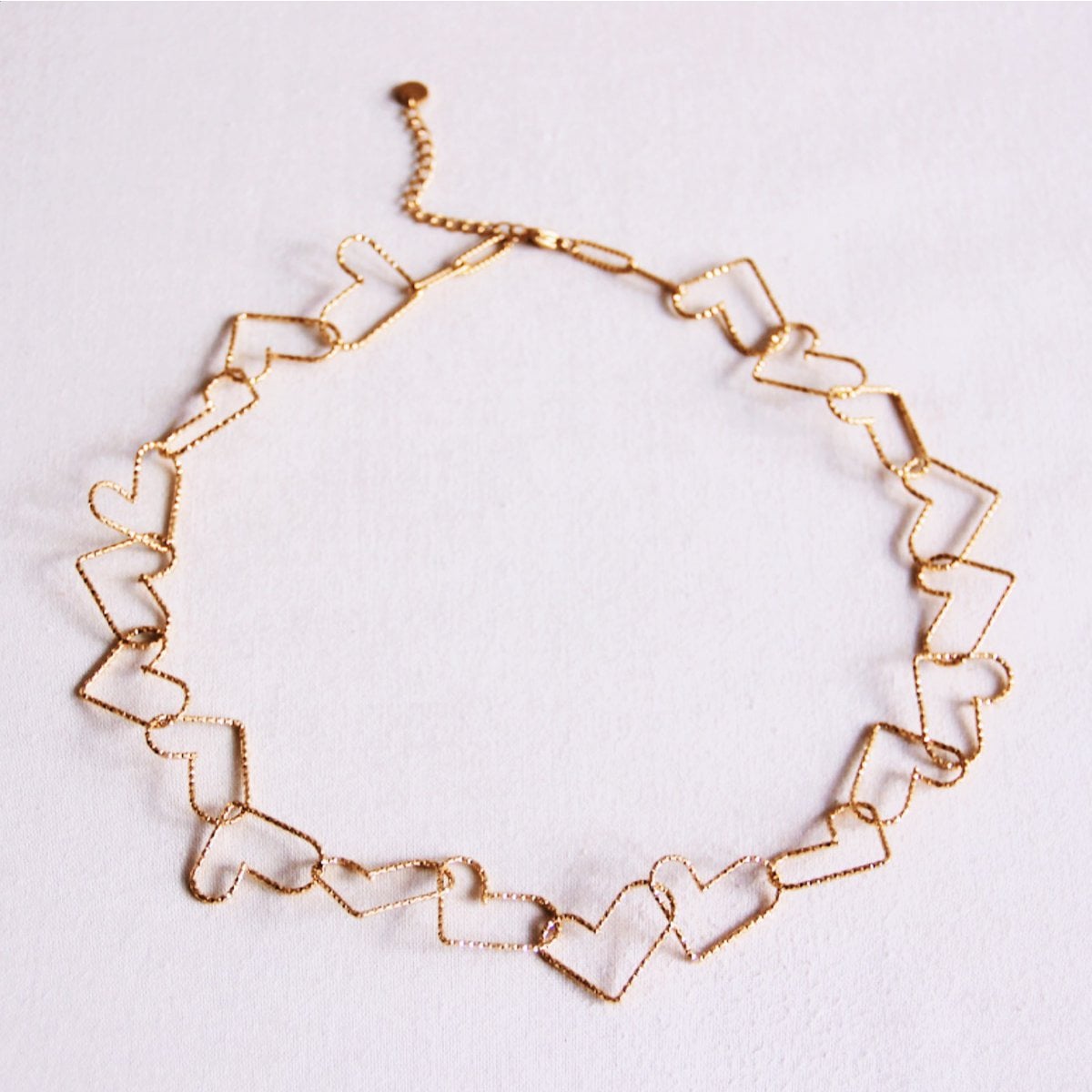 Ketting met verbonden harten 'groot' - goud - Selva & Co
