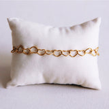 Armband met verbonden harten - goud - Selva & Co