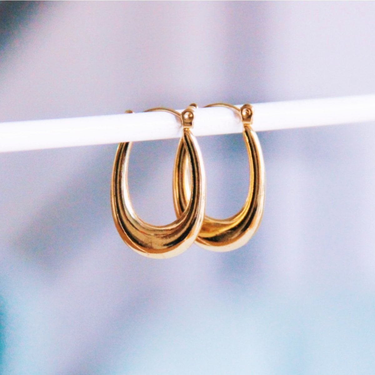 Stainless steel oval earring flared - Selva & Co