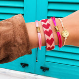 Bordeaux and salmon woven Miyuki beaded armband with heart-shaped design by Bazou, showcasing intricate craftsmanship and vibrant colors.